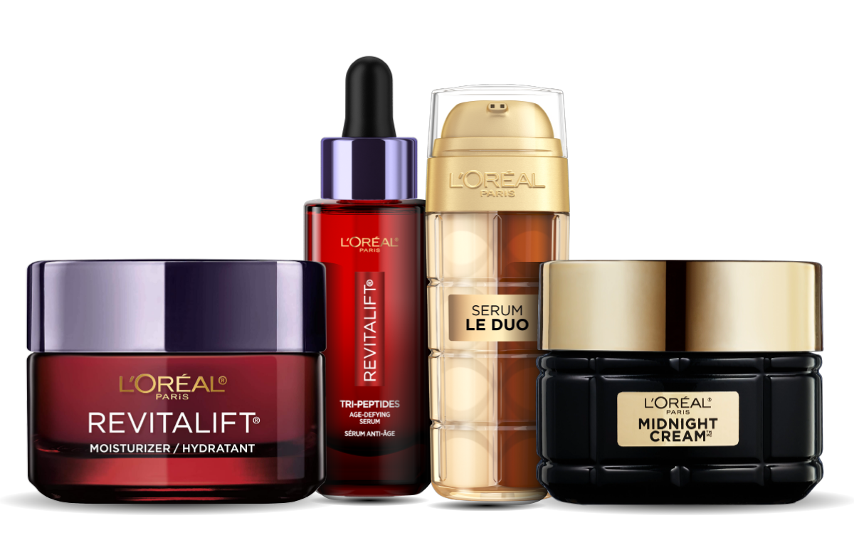 Four L'Oréal Paris skincare products including Revitalift moisturizer, serum, duo serum, and Midnight Cream.
